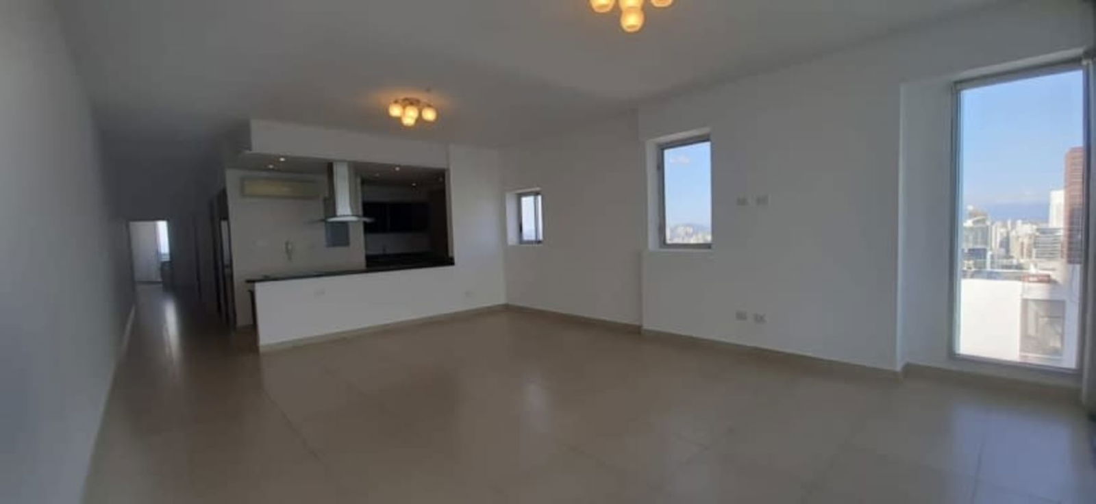 Modern kitchen with granite countertops and breakfast bar in luxury apartment PH BICSA Panama City