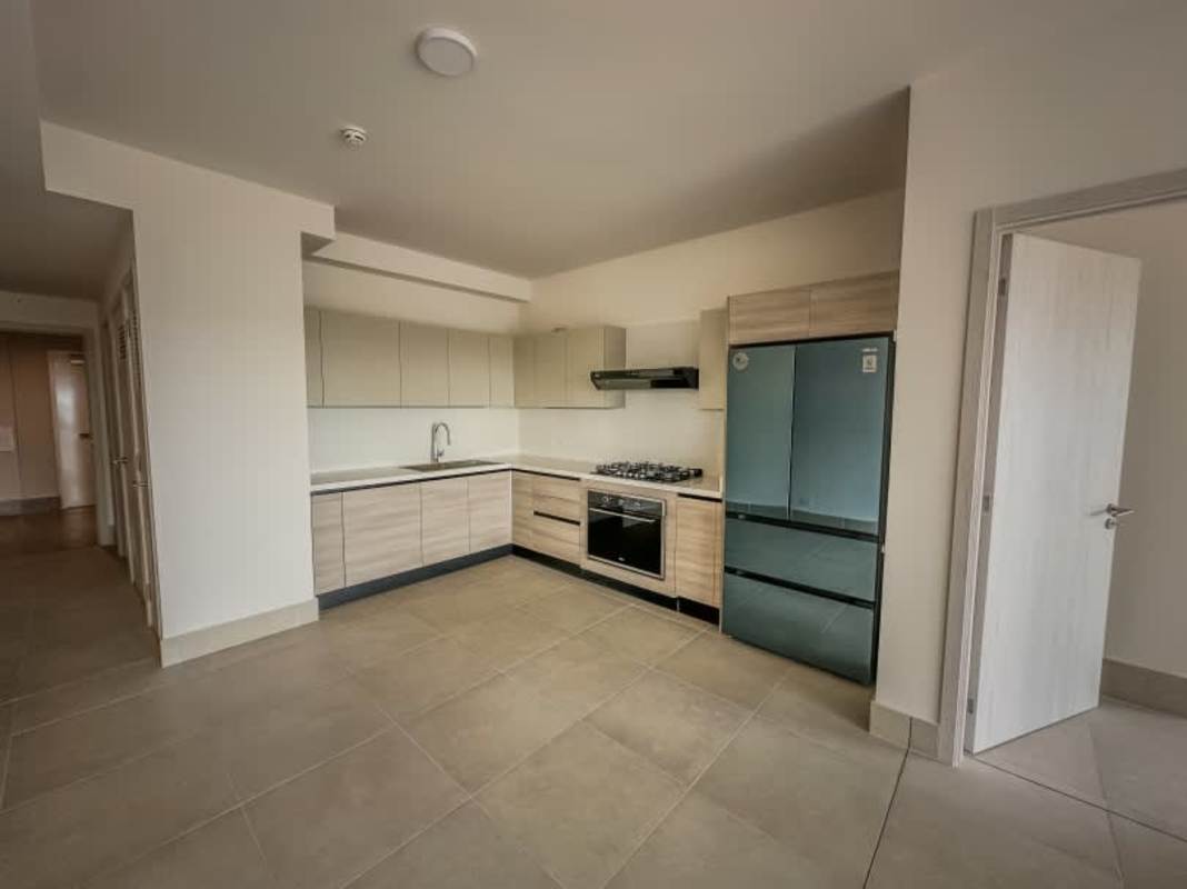 Kitchen with light wood cabinetry, granite countertops, built-in appliances PH Ocean House