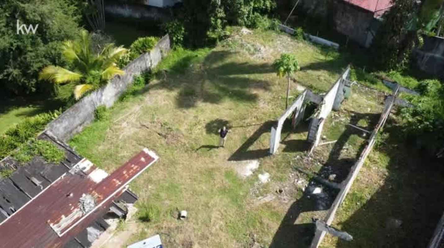 Vacant lot with partially demolished structure aerial click in San Francisco Panama