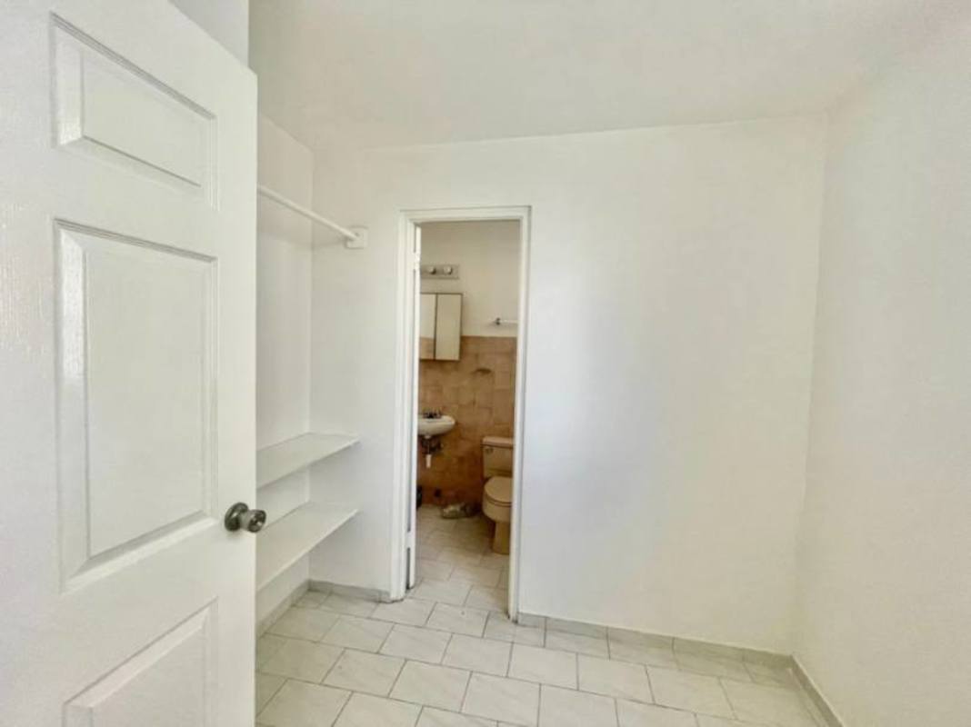 Bright bedroom tile floor, closet, large windows, San Francisco Bay Panama