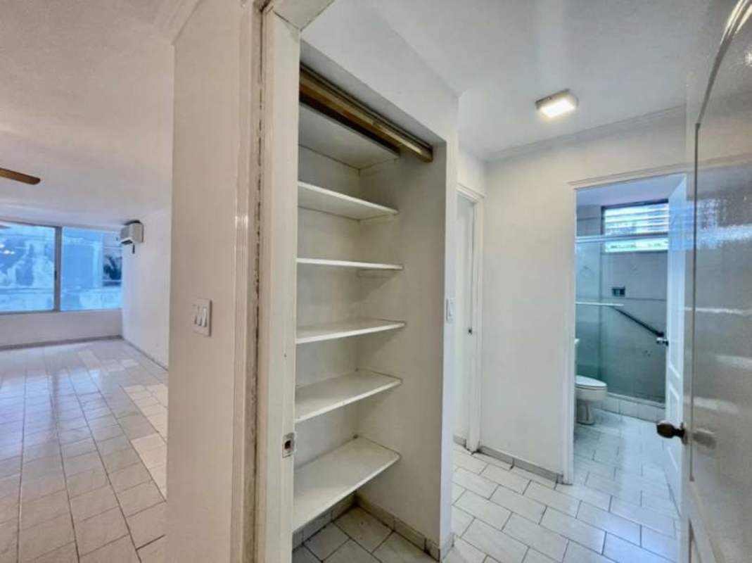 Bright hallway with white walls, access to bedrooms and bathrooms in San Francisco Bay Panama