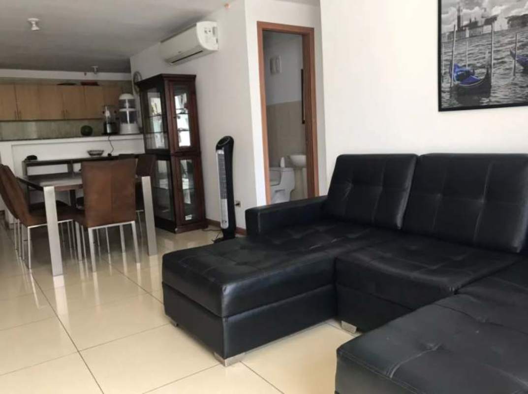 Open plan living dining with access to balcony modern furnishings in PH Mahogany Tower Condado del Rey Panama