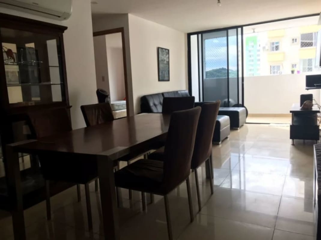 Open living and dining area with access to private balcony fully furnished in PH Mahogany Tower, Condado del Rey Panama