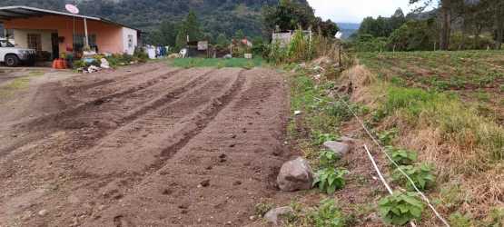 Rural corner land lot beside small farmhouse and mountains Volcán Panama