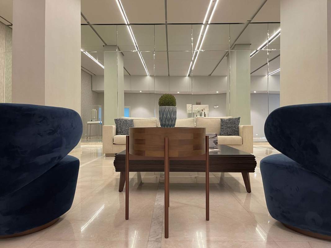 Minimalist bedroom with large window and cityscape views PH Luna Costa del Este Panama
