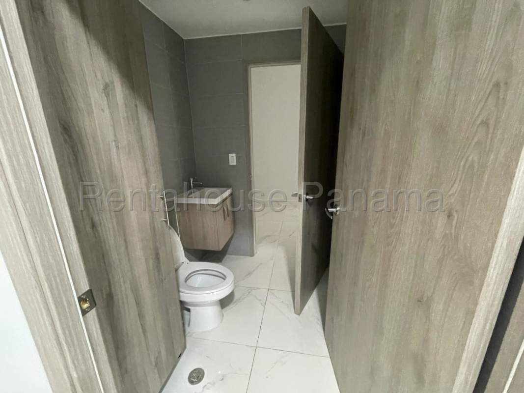 Spacious conference room with wood paneling, large screen and ergonomic chairs in Costa del Este Panama