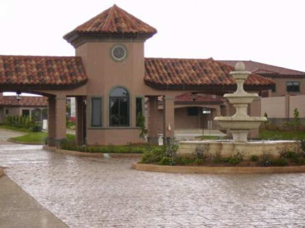 Secure gated access and decorative fountain at Versalles in Costa Sur Panama City