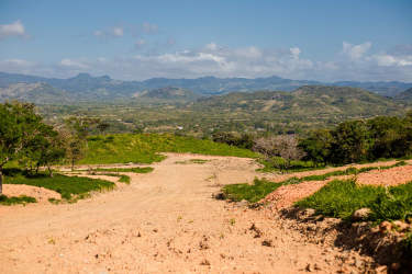 Large undeveloped lot with hills and blue sky in La Pintada Coclé Panama