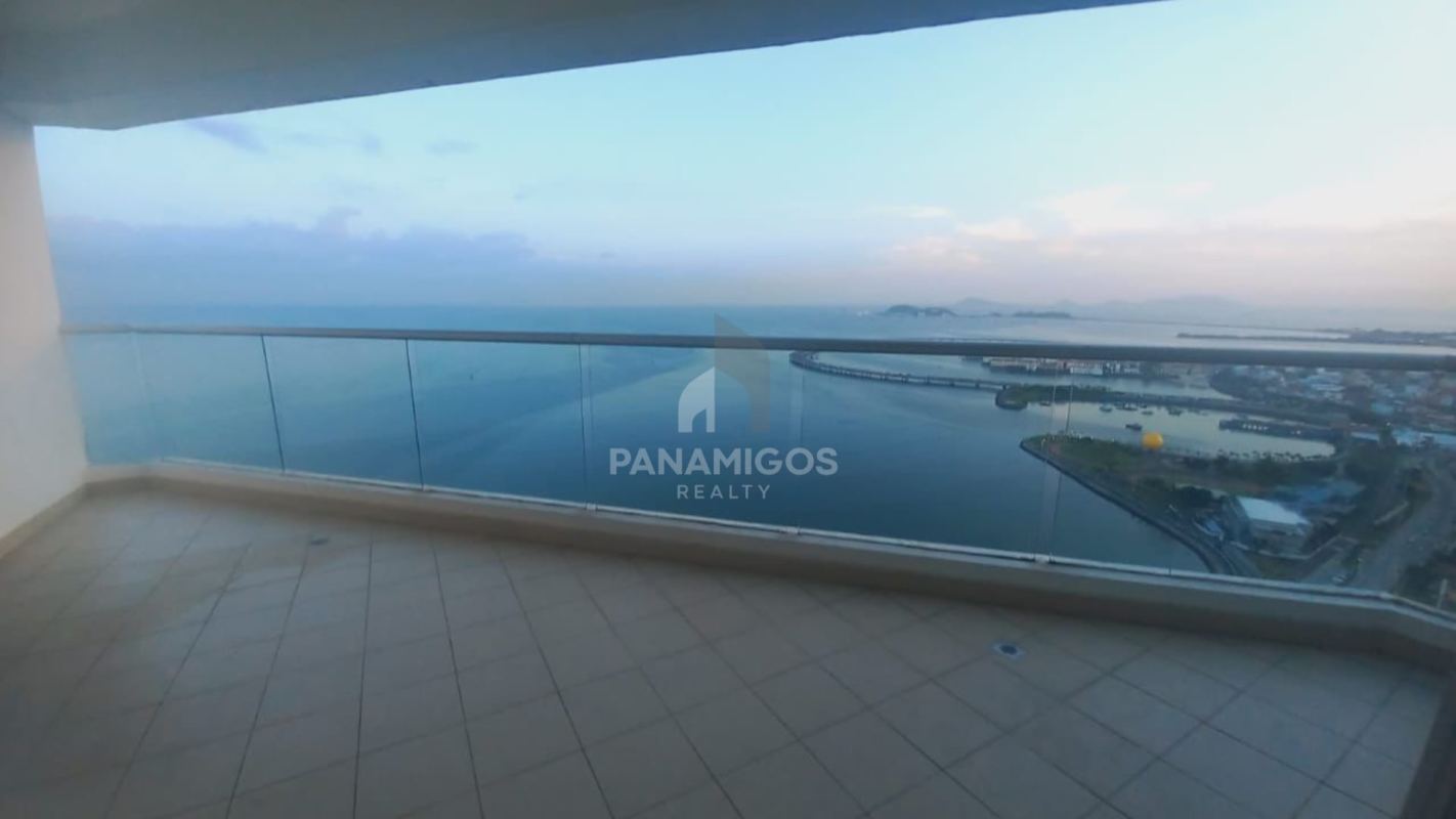 Spacious master bedroom with floor-to-ceiling windows and ocean views in PH Rivage Panama City