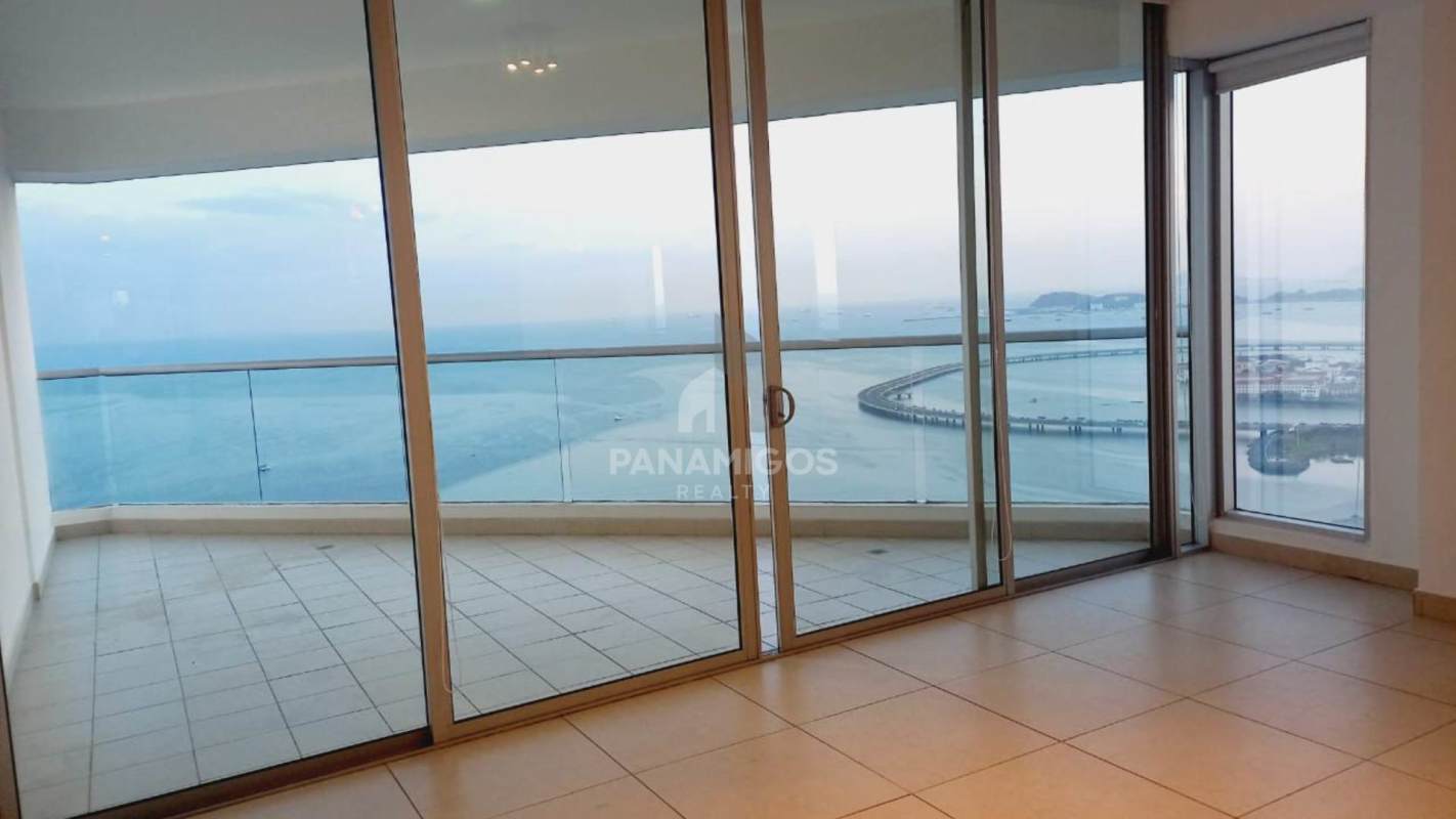 Bright open kitchen with island, granite counter, stainless appliances, ocean view in PH Rivage Tower Panama City