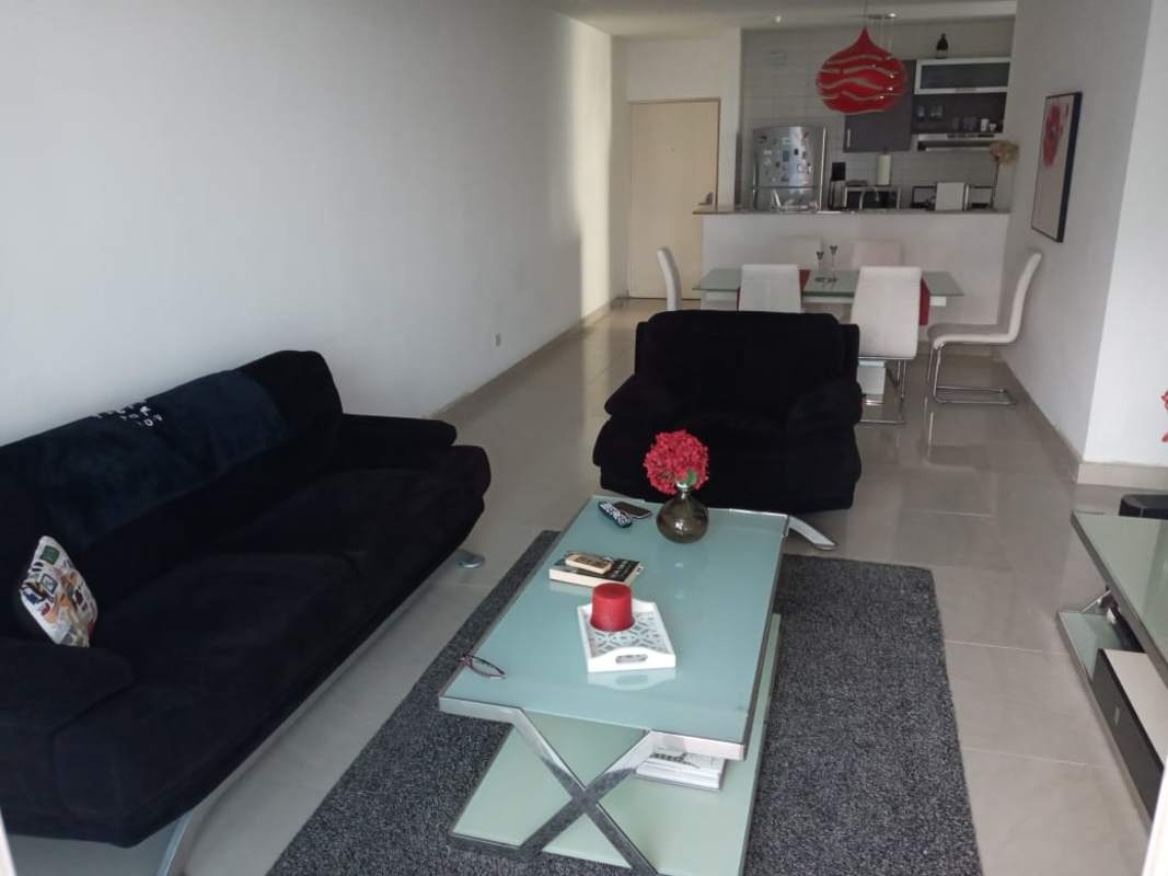 Bright bedroom with large windows and city skyline view in PH Pacific Sky Punta Paitilla