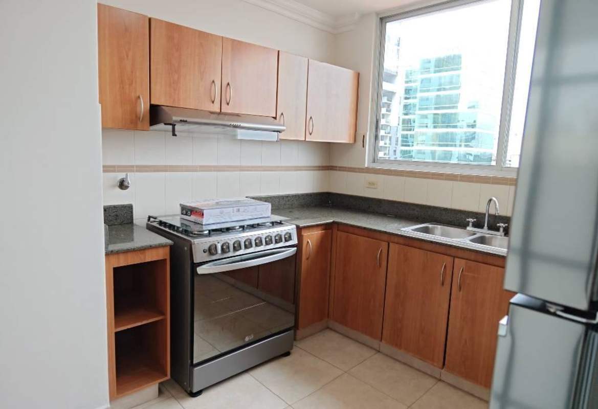 Spacious kitchen granite countertops, light cabinetry, large window with city view PH Fairmont Plaza Panama