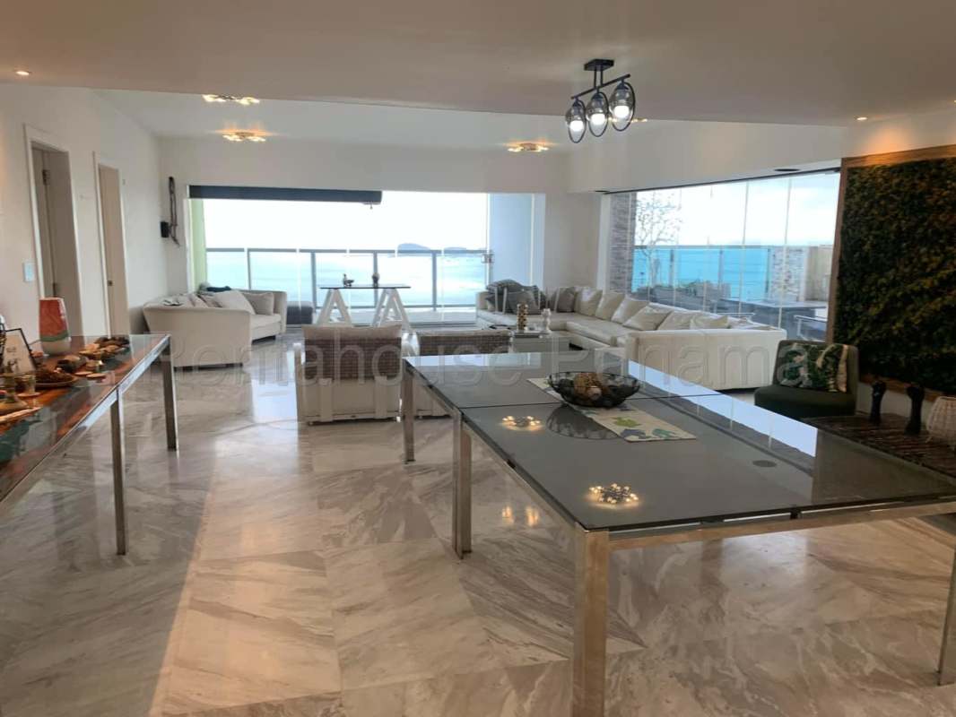 Designer kitchen and elegant dining area with marble floors in penthouse Yoo Panama