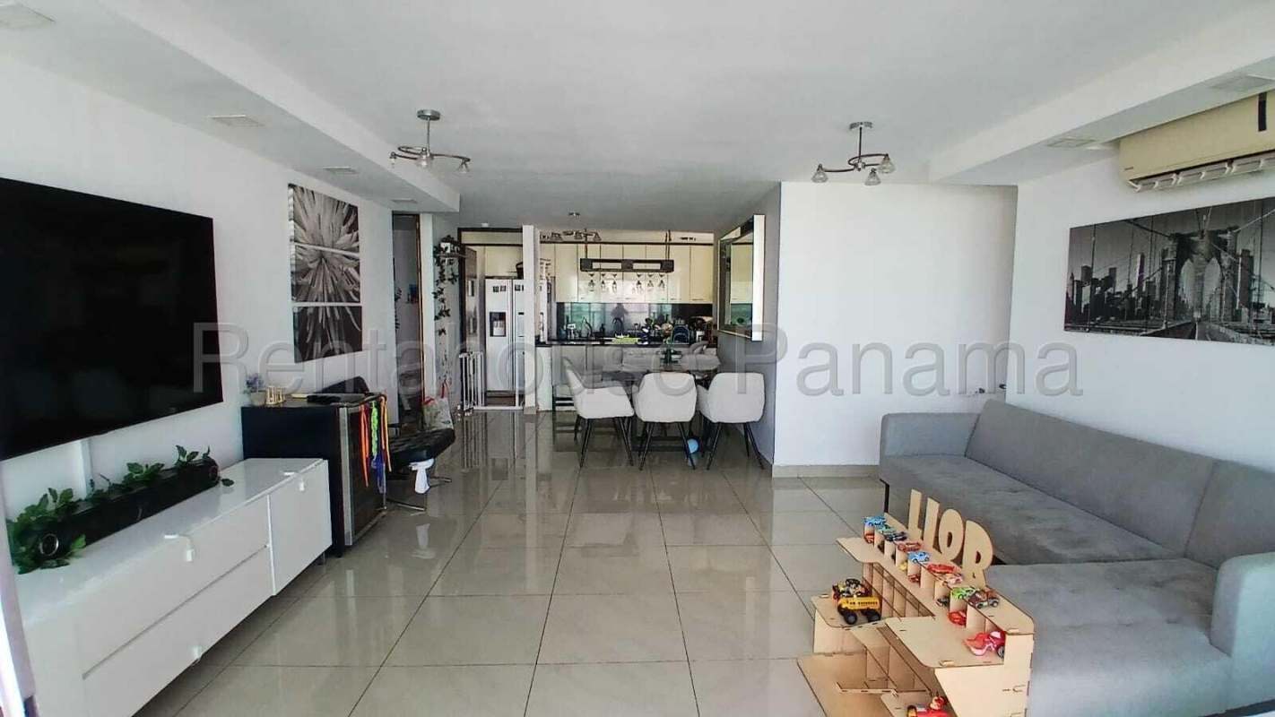 Large balcony with panoramic city skyline and partial ocean view in PH Serenade Tower Panama City