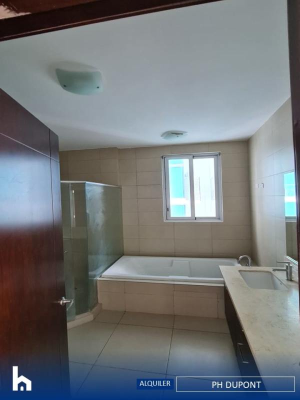 Spacious master suite with walk-in closet, bath, and ocean skyline views in PH Dupont Panama City