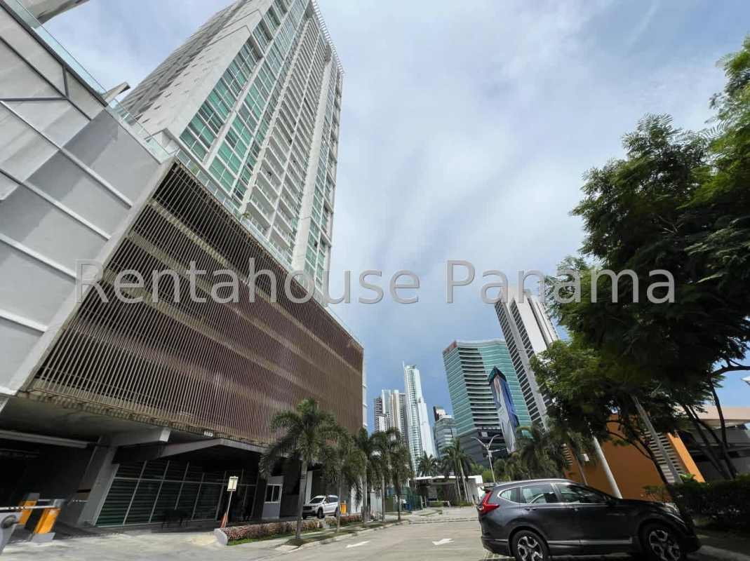 Bright master bedroom with floor to ceiling windows panoramic Pacific Ocean view Panama apartment