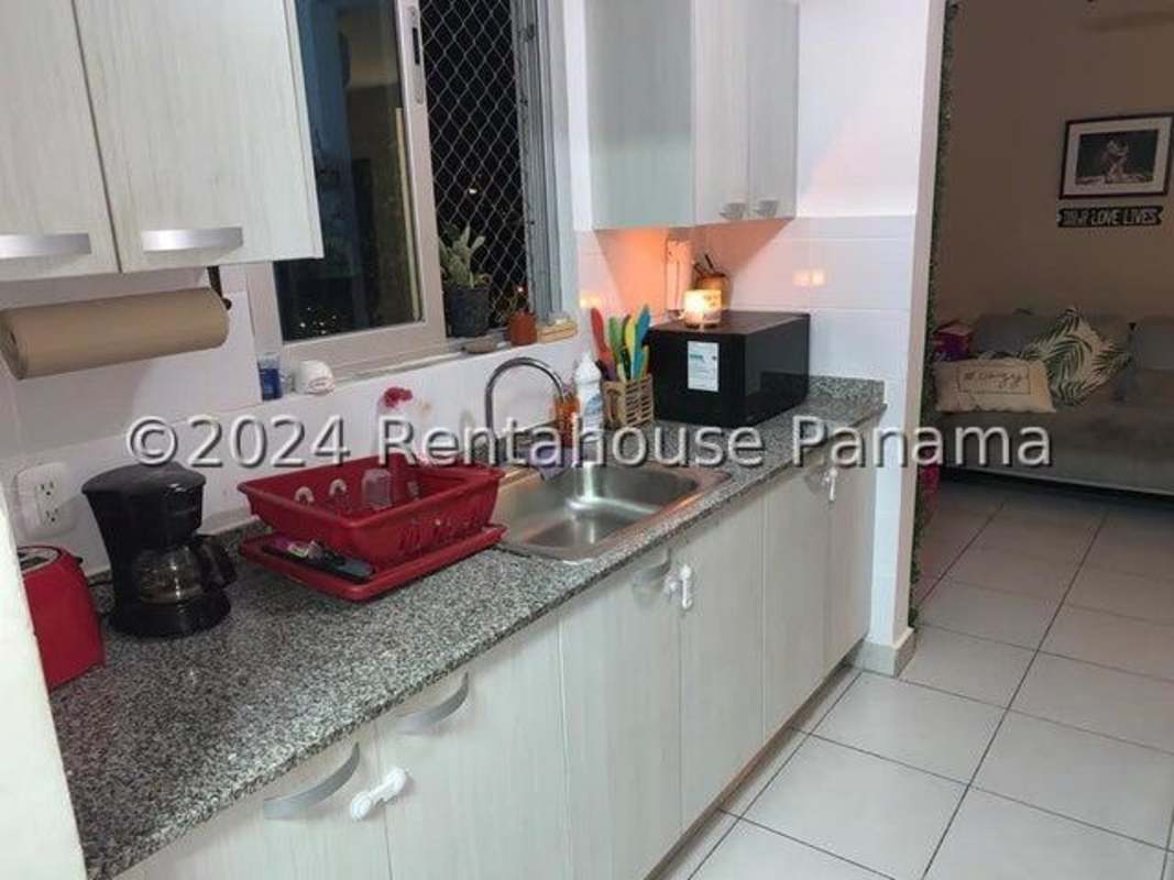 Rooftop swimming pool with blue tiling and skyline views at PH Lefevre Park Panama City