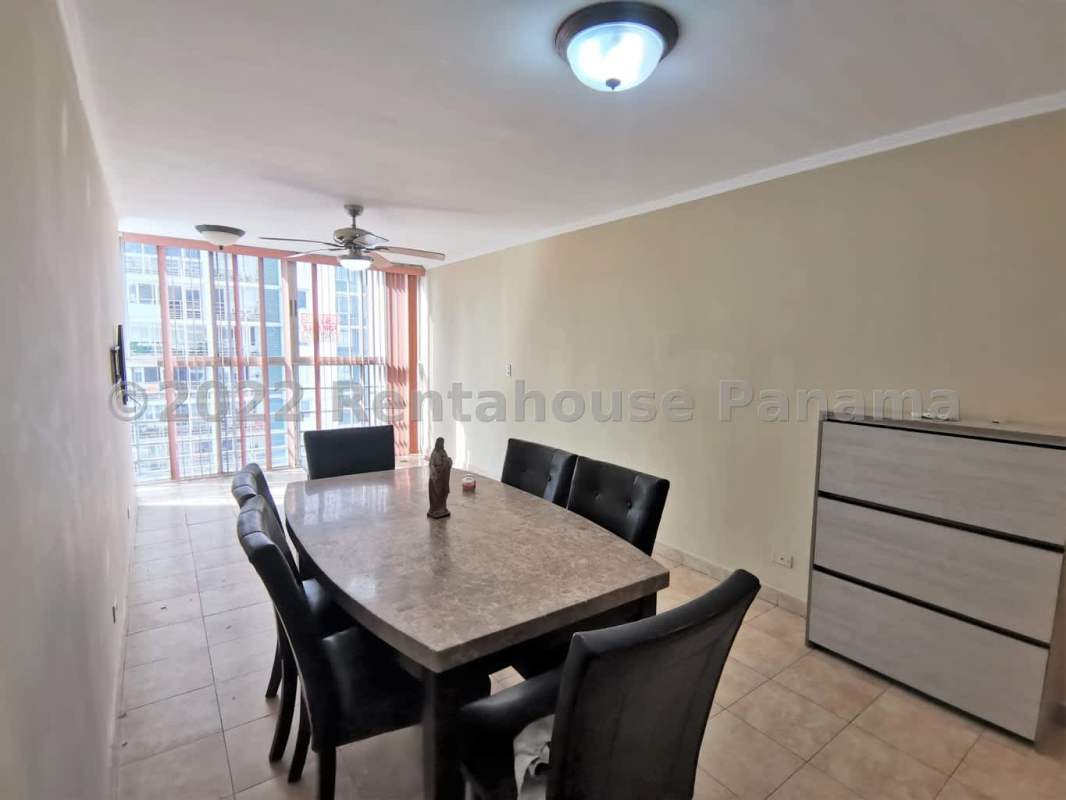 Spacious dining room with large window and ceiling fan in PH Park Panama City