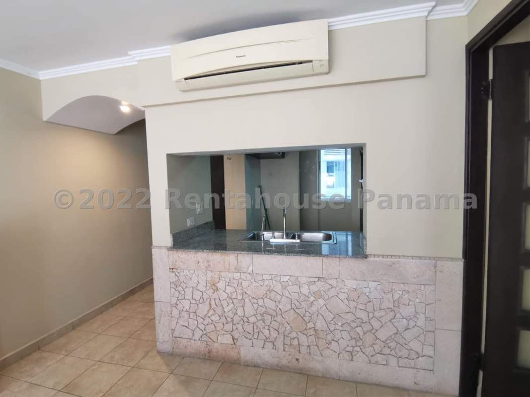 Kitchen with granite counters, pass-through window, cabinets in PH Park Panama