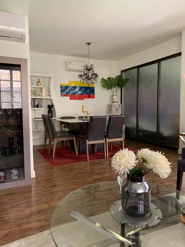 Remodeled open kitchen with island, pendant lighting, stainless appliances in Villa Valencia Costa Sur Panama