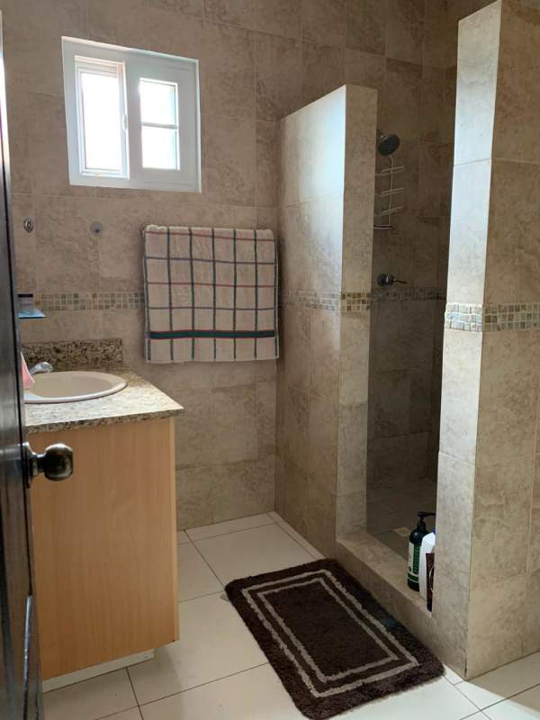 Private covered patio terrace with ceiling fan and sitting area Villa Valencia Costa Sur Panama City