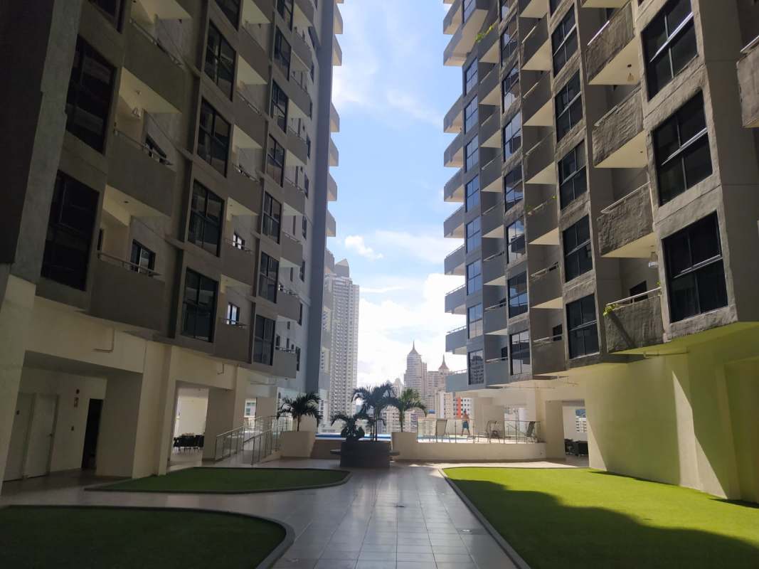Bright living dining area with balcony and city views PH Worldwide Plaza Via España