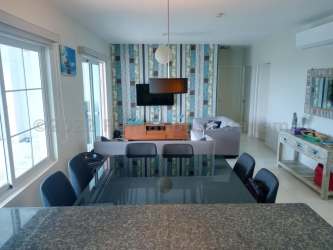 Open plan kitchen with granite counters in Bijao Beach Condo Panama