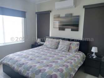 Bright master bedroom with ocean views and built-in closets at Bijao Beach & Residences Panama