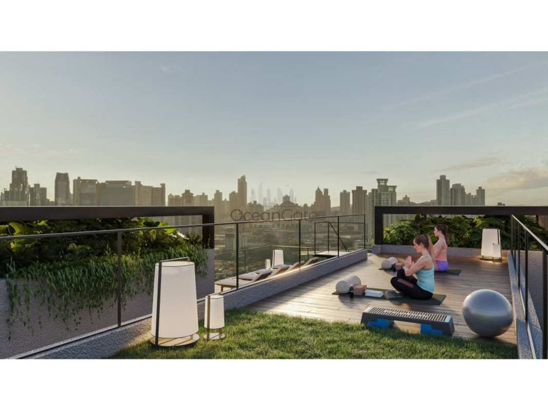 Rooftop deck with yoga zone and skyline view at PH Be Living Panama City