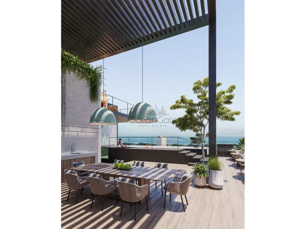 Contemporary rooftop terrace with dining area and ocean view PH Be Living Panama