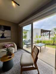 Minimalist bedroom with garden view sliding doors in Playa Caracol