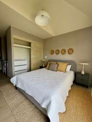 Contemporary open-plan living dining room with garden views Playa Caracol Panama