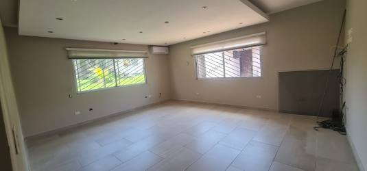 Large walk-in closet with shelving and mirrored door Margarita Colón home