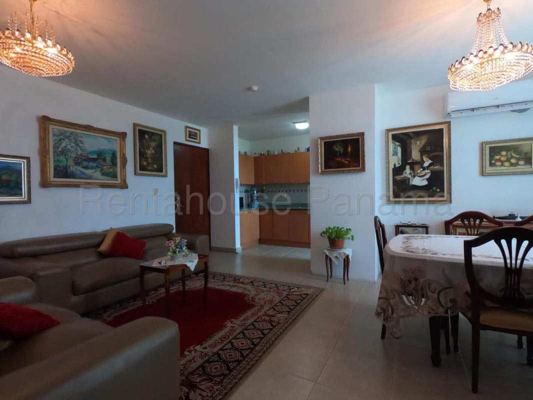 Bedroom featuring built-in closet, AC unit and large windows in Costa del Este Panama