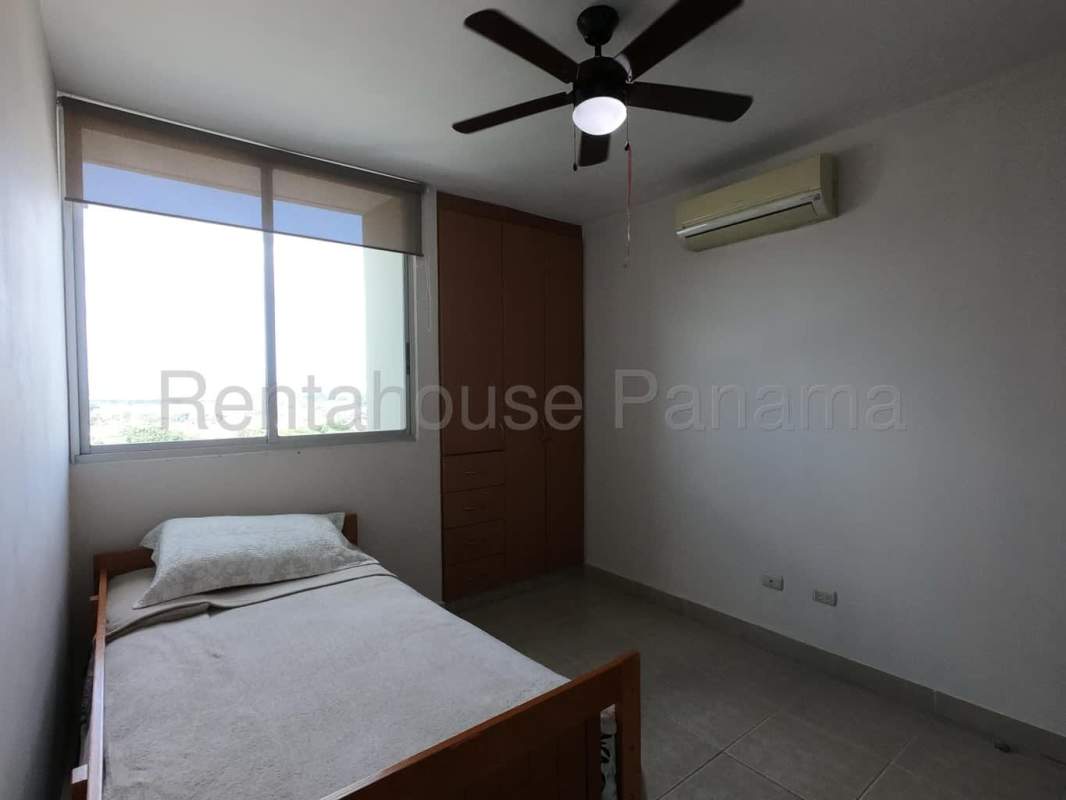 Swimming pool with sundeck surrounded by high-rise towers in Costa del Este Panama