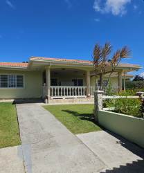 Covered outdoor terrace with scenic mountain and garden views at countryside estate La Laguna San Carlos