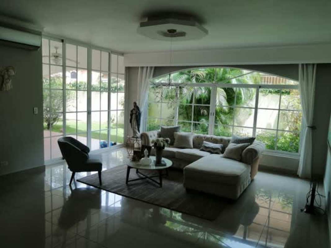 Wood cabinet kitchen with black granite counters and large window Clayton Panama