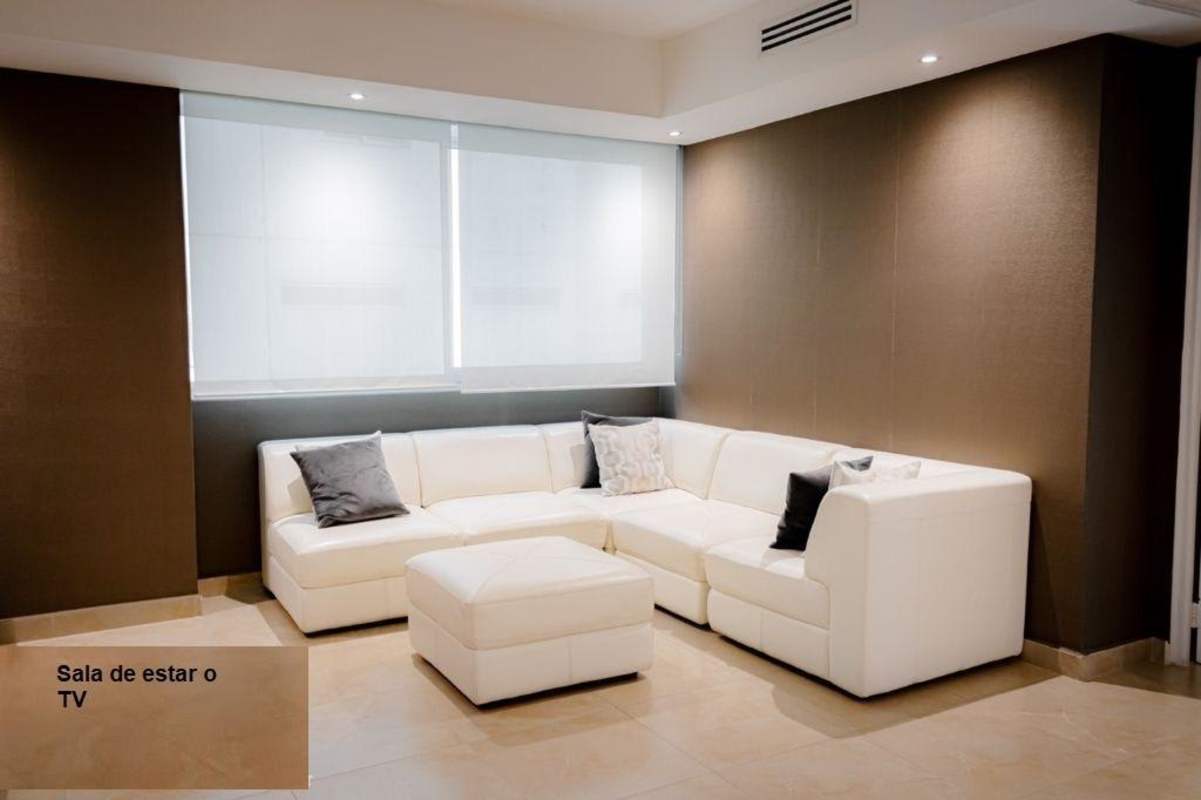 Living and TV room with large sectional sofa in PH Aquamare Punta Pacifica Panama