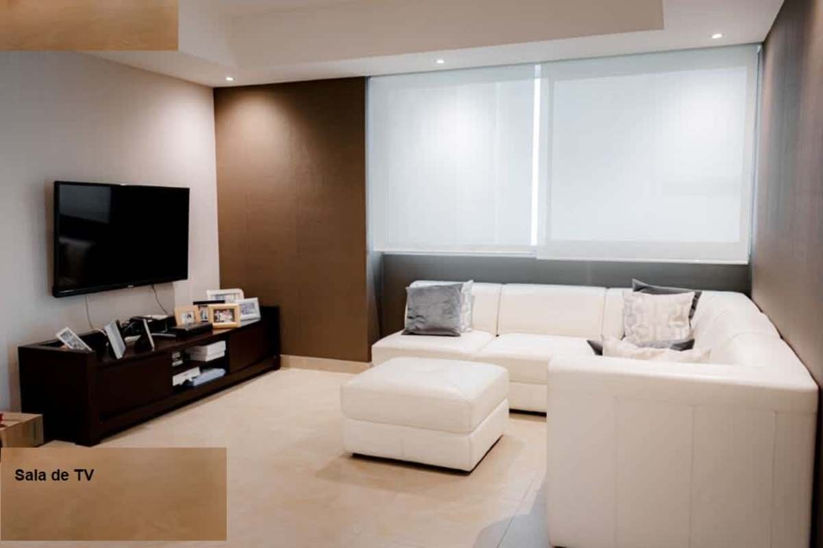 Minimalist TV room with white sectional sofa PH Aquamare Panama