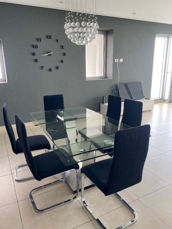 Master bedroom with large windows overlooking ocean in PH Rivage Panama