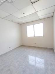 Empty interior room with tiled floor, window, suspension ceiling Altos de las Huacas Vacamonte