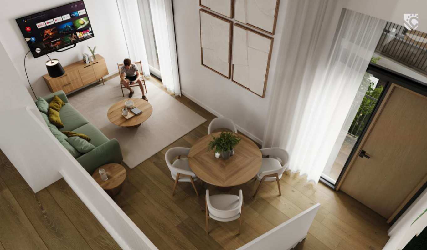 Modern living room with green sofa, wood floors, large windows in restored colonial PH Casco Viejo