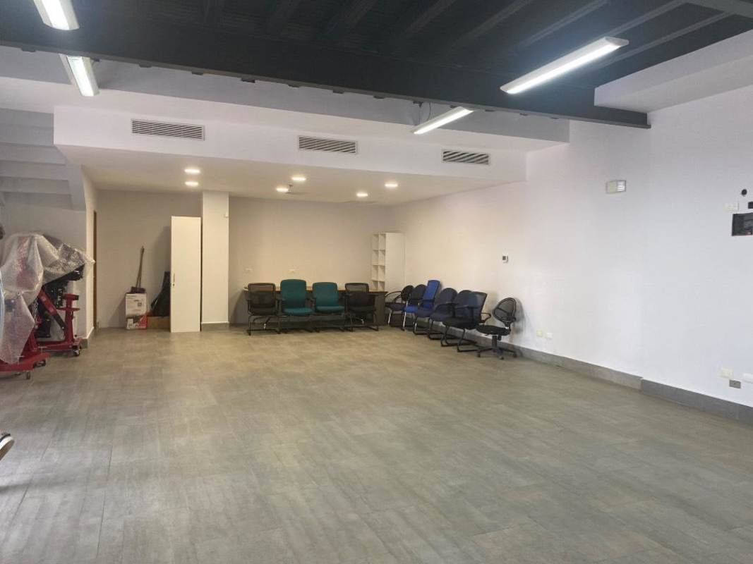 Private office room with large window overlooking Panama City skyline Via Porras