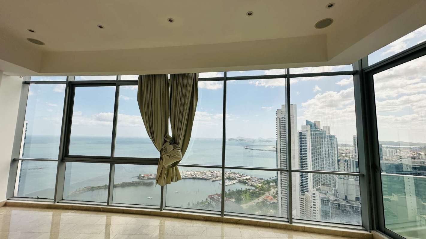 Spacious living room penthouse with marble floors panoramic windows at Allure at the Park Panama City