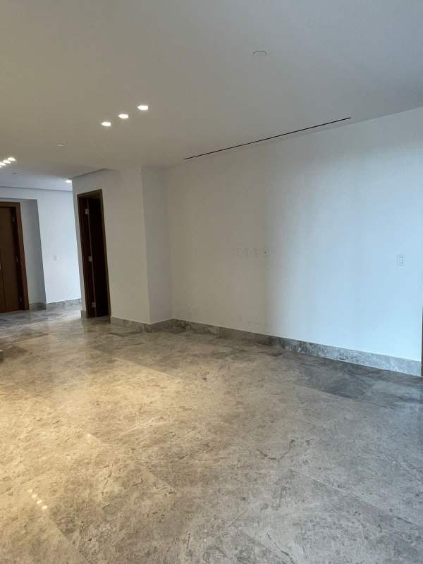 Master bedroom with panoramic golf view, marble floors, and modern finishes in Santa María Panama