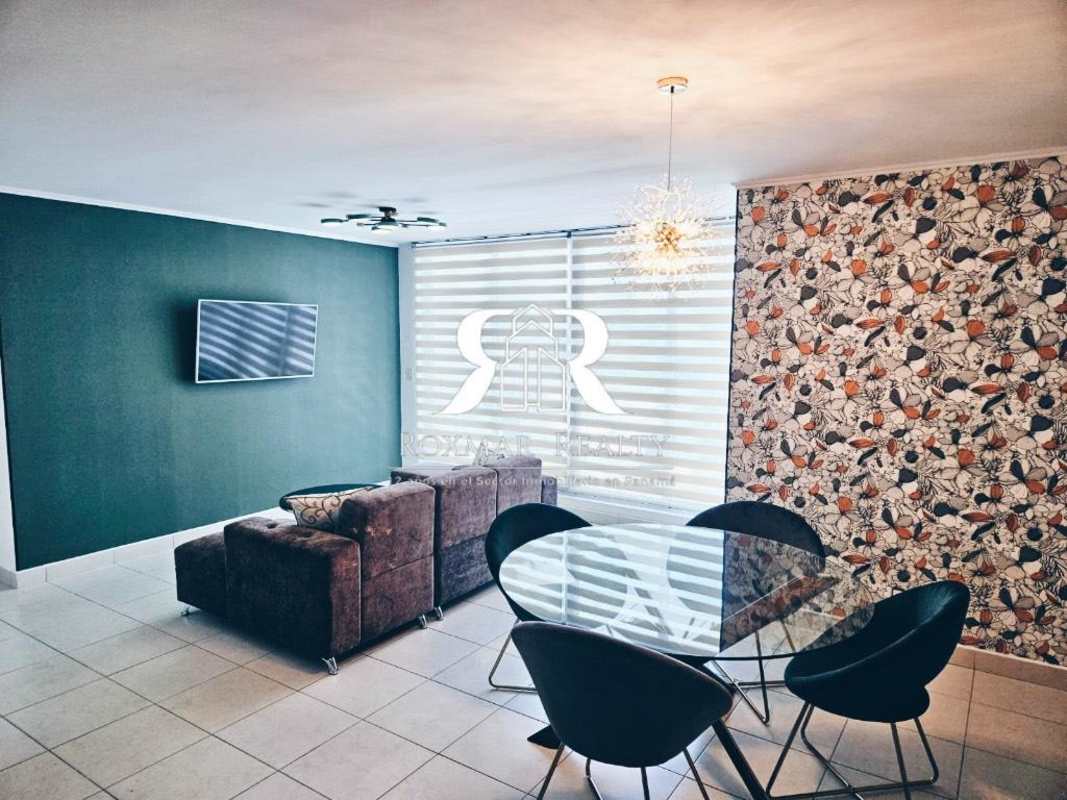 Stylish open living dining space, dark accent wall, blinds, sectional sofa, decor Panama Vista Hermosa