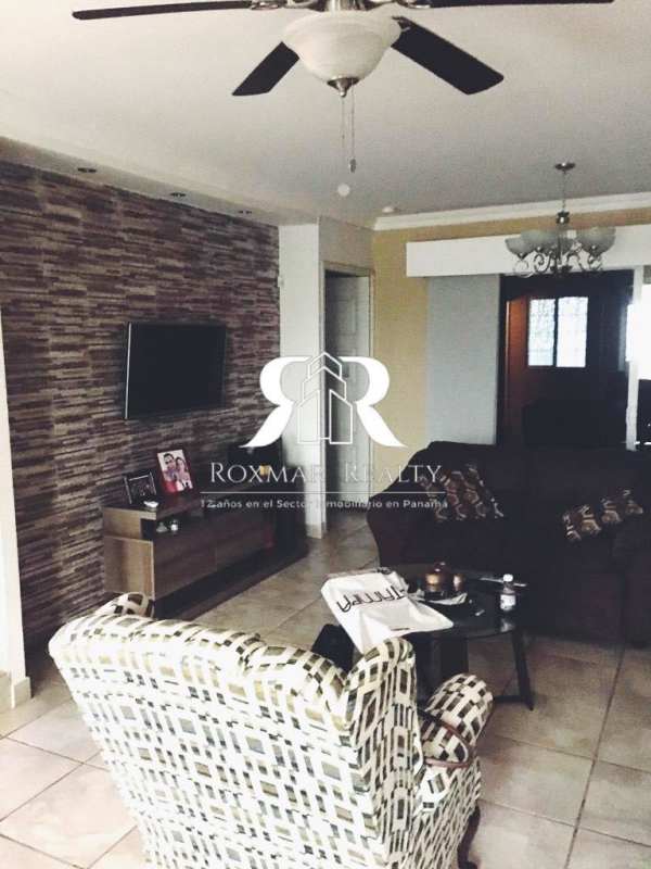 Family room open plan with tile floors ceiling fan large windows Brisas del Golf Panama home