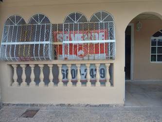 House exterior with covered porch, secured arched windows, Mediterranean design San Bernardino Arraiján Panama