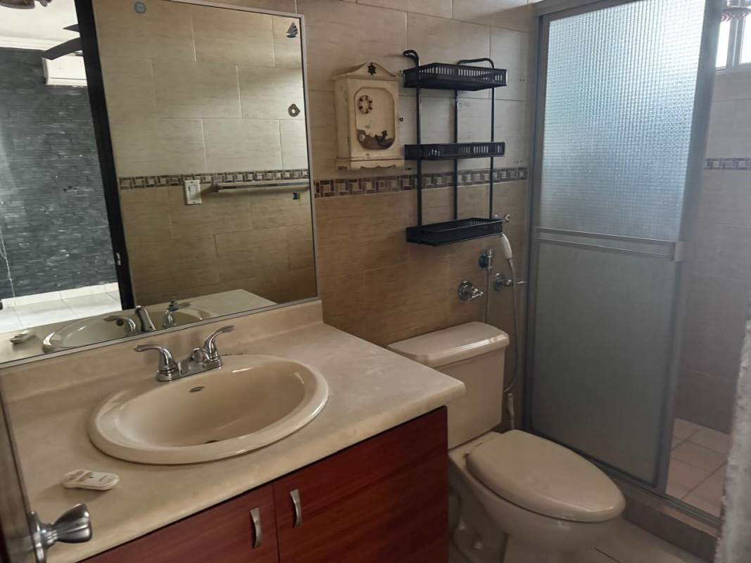 Spacious bathroom with glass shower, mirror, vanity in Castel Novo house Chanis Panama