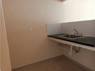 Compact kitchenette with sink tiled floor Valle de los Cerezos Panama